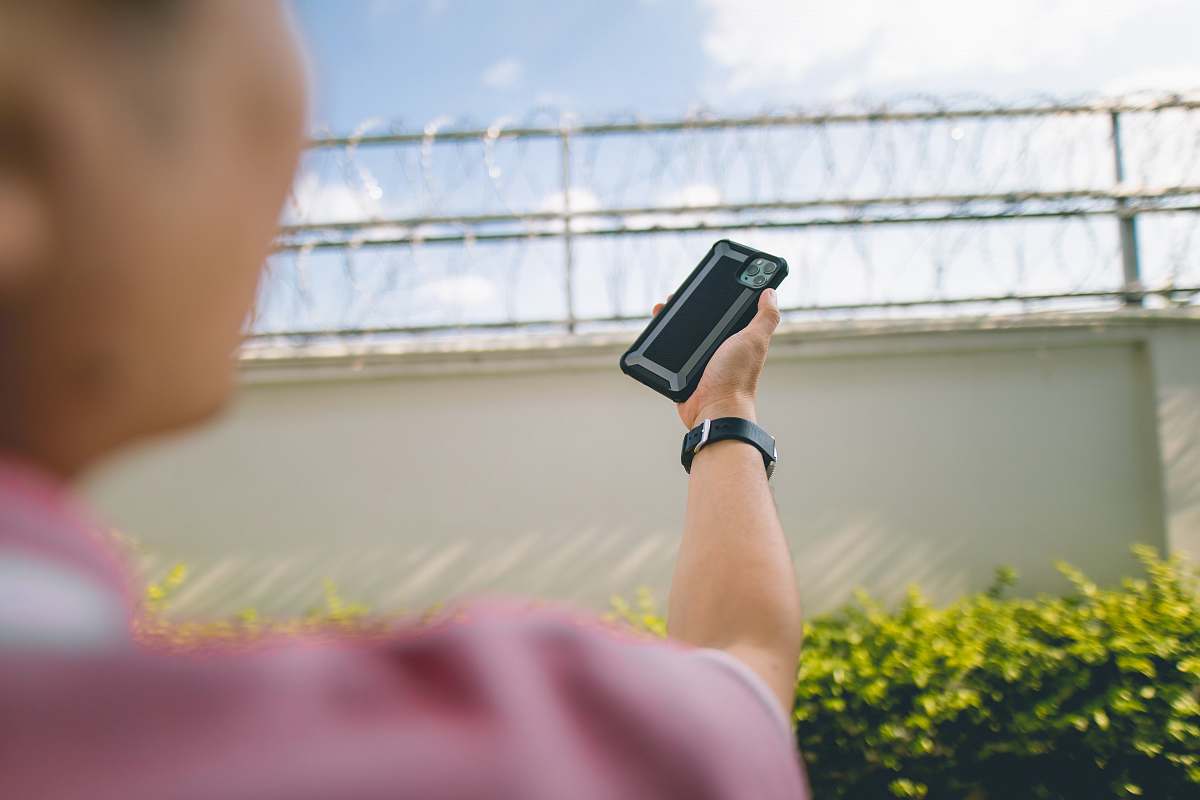 electronics person holding phone mobile phone